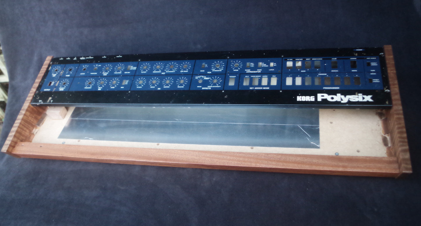 Korg Polysix wooden case crafted from Sapele wood with striking tiger stripe patterns.