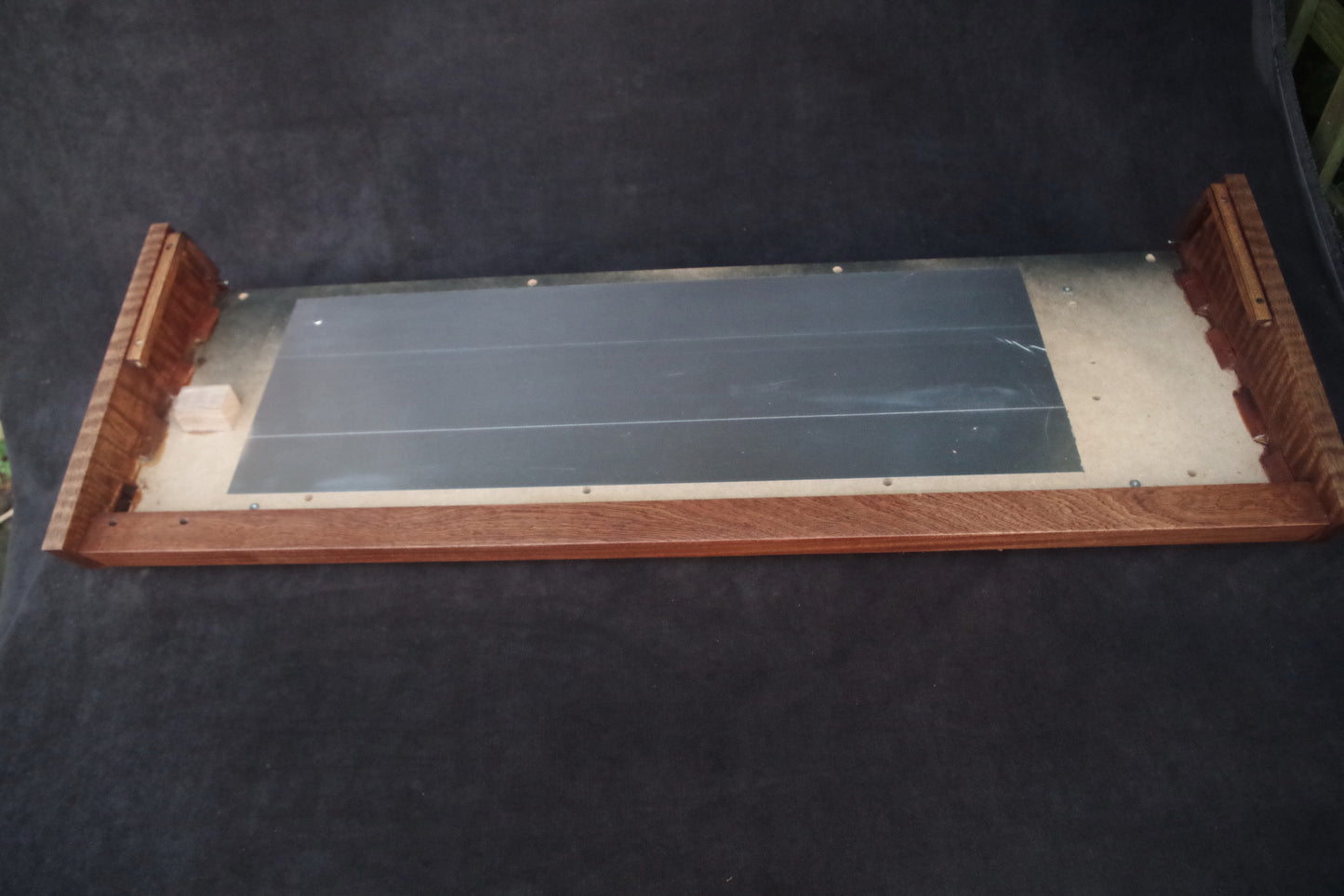 Korg Polysix wooden case crafted from Sapele wood with striking tiger stripe patterns.