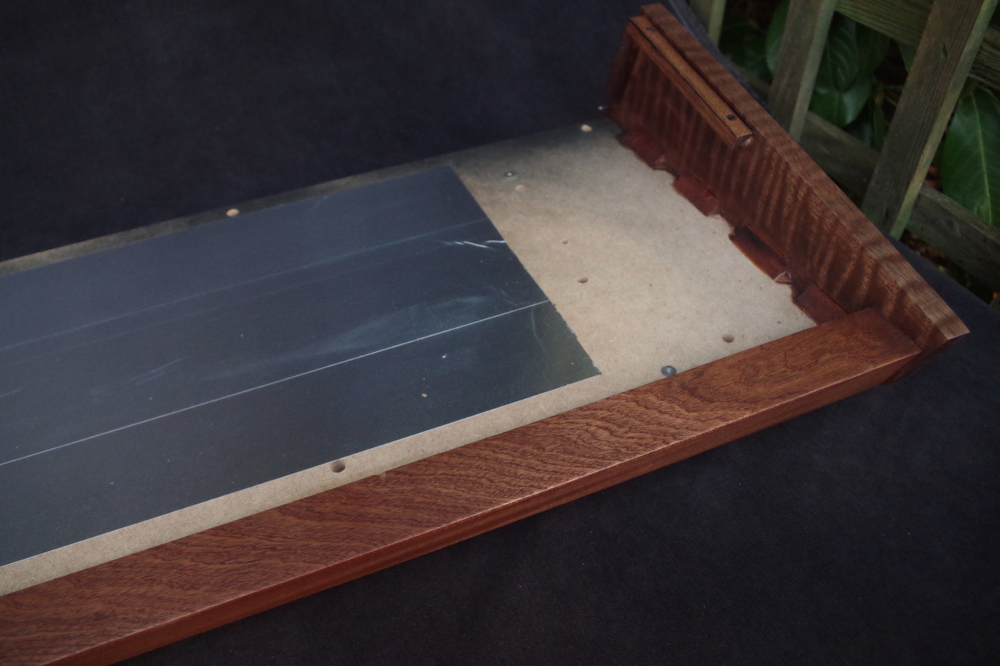 Korg Polysix wooden case crafted from Sapele wood with striking tiger stripe patterns.