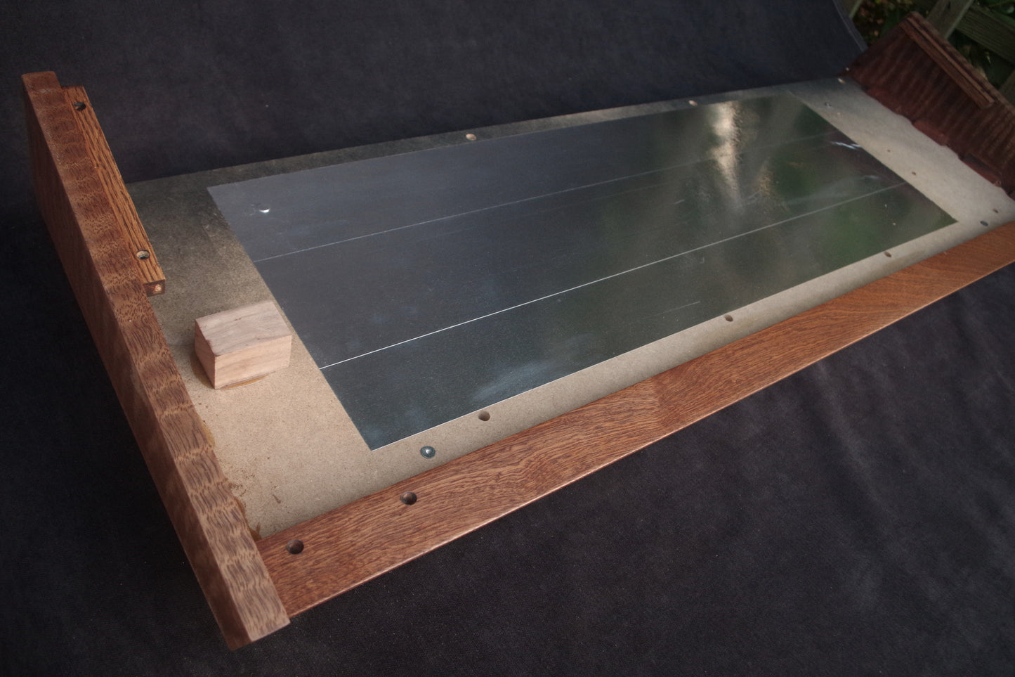 Korg Polysix wooden case crafted from Sapele wood with striking tiger stripe patterns.
